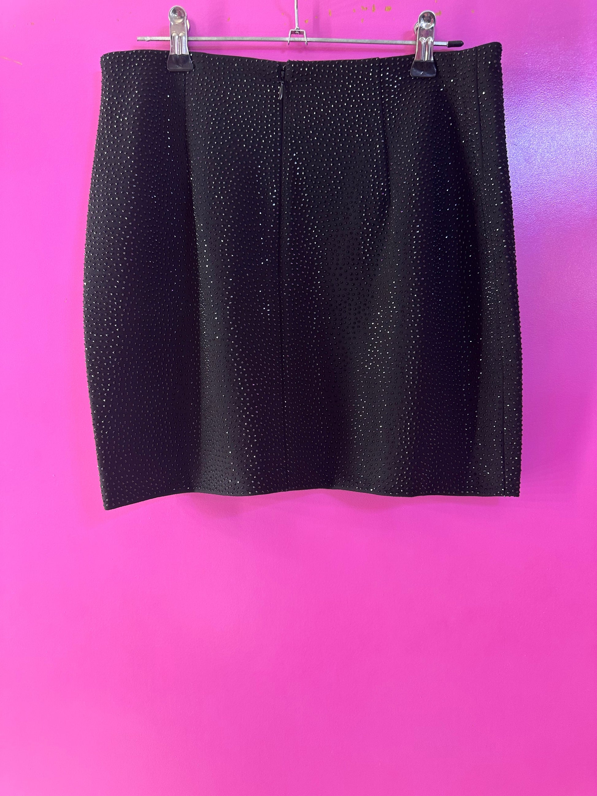 Falda negra de brillos